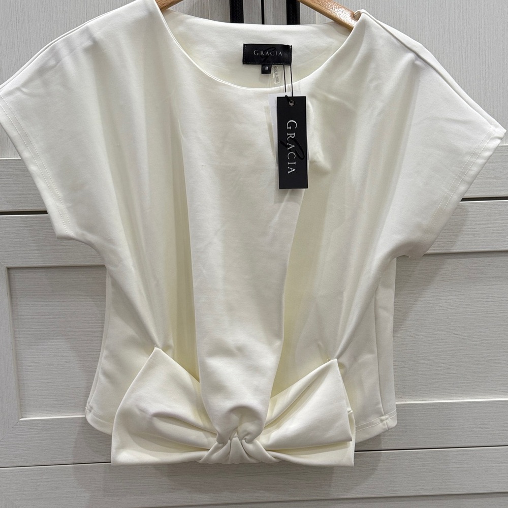 Never worn, new with tags! Cream cropped dress shirt with bow
